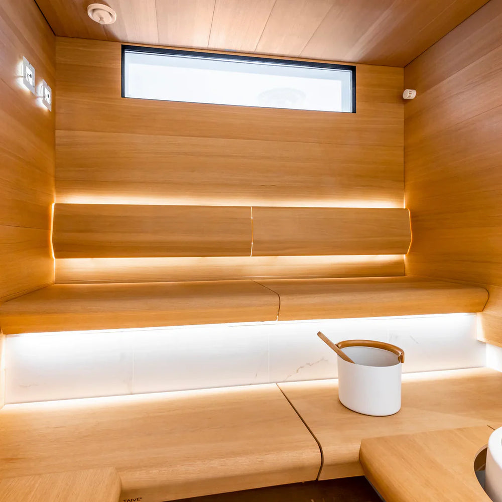 Sauna Linear with a stove lens