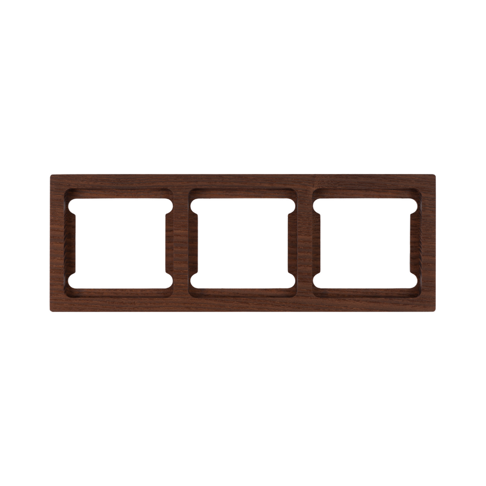 Wooden wall plate with three square openings on a white background