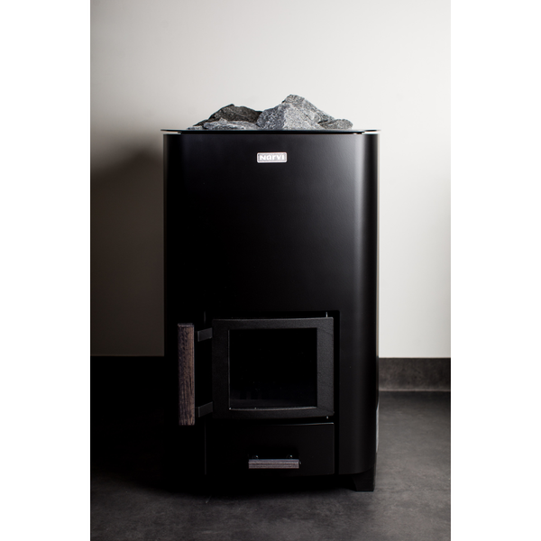 Narvi NC Wood Burning Sauna Heater filled with grey sauna stones 