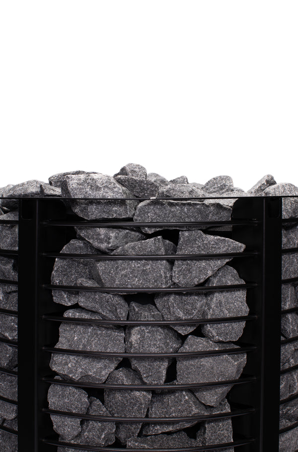 Narvi Inari Wood Burning Sauna Heater filled with grey sauna stones on a white background  