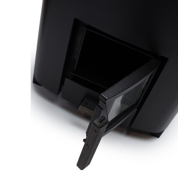 Narvi NC Wood Burning Sauna Heater filled with grey sauna stones on a white background