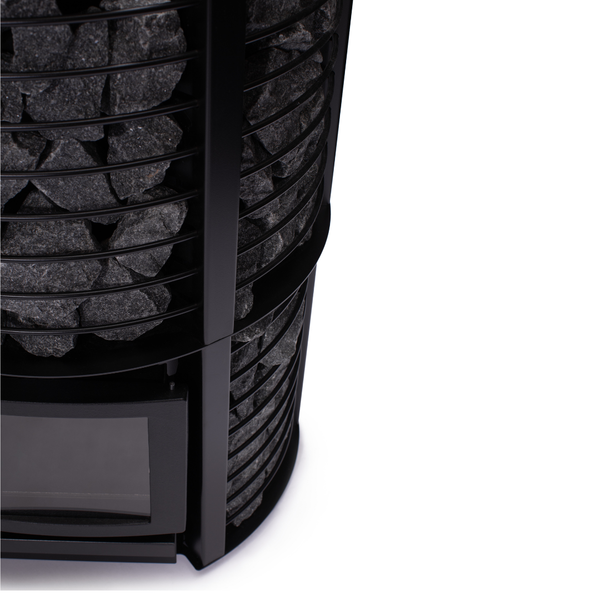 Narvi Inari Plus Wood Burning Sauna Heater filled with grey sauna stones on a white background