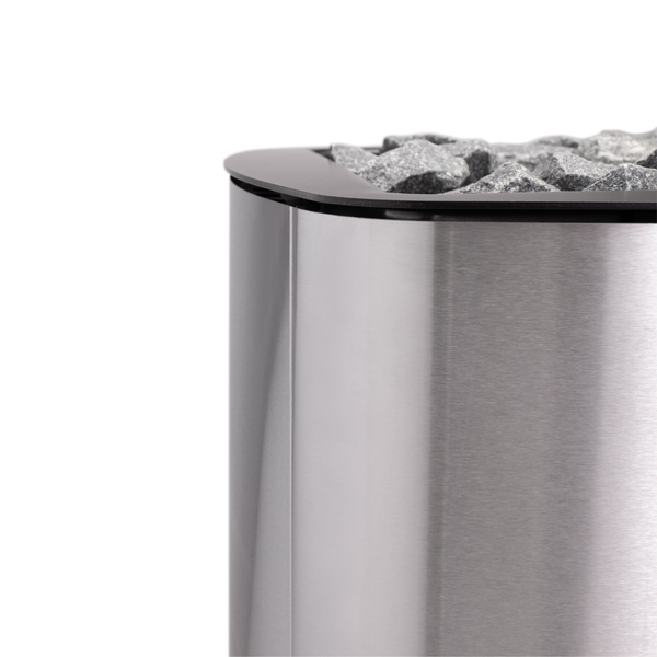 Narvi NC Wood Burning Sauna Heater filled with grey sauna stones on a white background