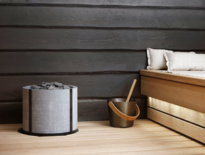 Integratable Round Standing Soapstone Cladded Electric Sauna Heater Tulikivi Naava Integrated In Sauna From Close