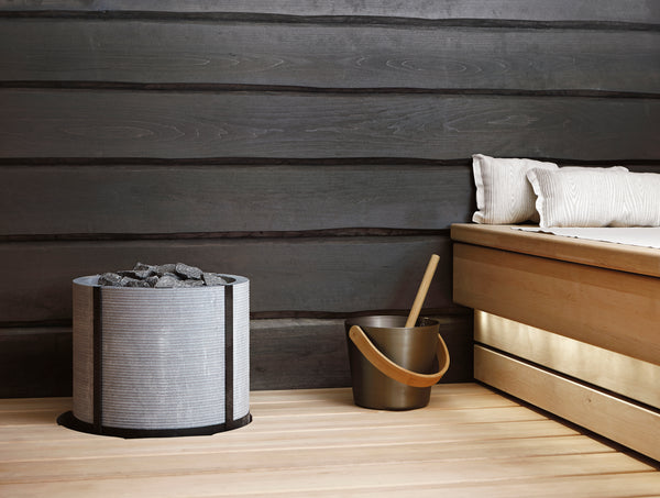Integratable Round Standing Soapstone Cladded Electric Sauna Heater Tulikivi Naava Integrated In Sauna From Close