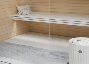 Round Standing Soapstone Cladded Electric Sauna Heater Tulikivi Riite Integrated In Sauna From Close