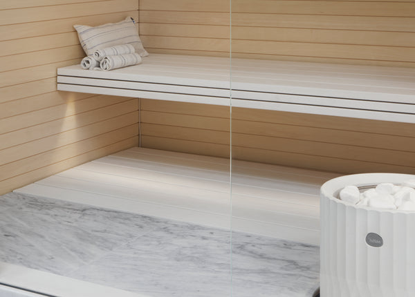 Round Standing Soapstone Cladded Electric Sauna Heater Tulikivi Riite Integrated In Sauna From Close