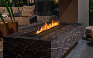 Modern indoor fireplace with flames in a living room setting