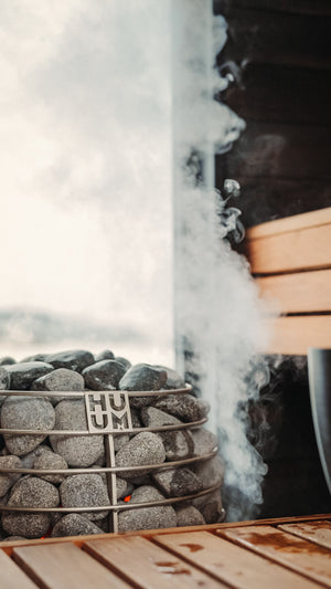 Electric sauna heater in a wooden sauna