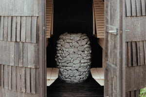 HUUM electric sauna heater in a wooden sauna.