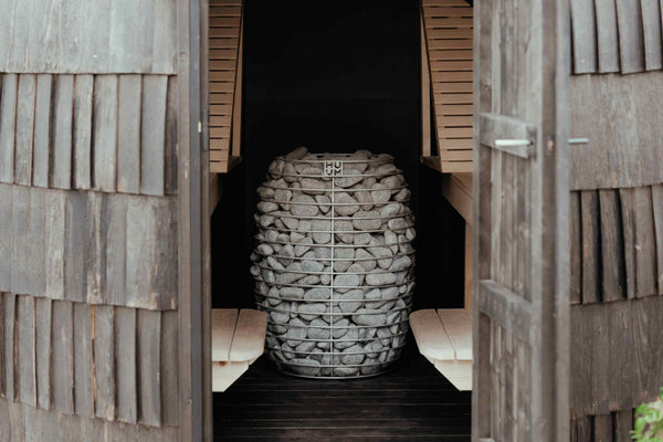 HUUM electric sauna heater in a wooden sauna.