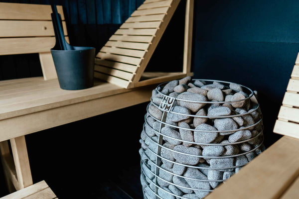 HUUM electric sauna heater in a wooden sauna