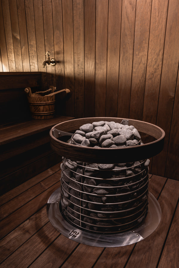 HUUM electric sauna heater in a wooden sauna