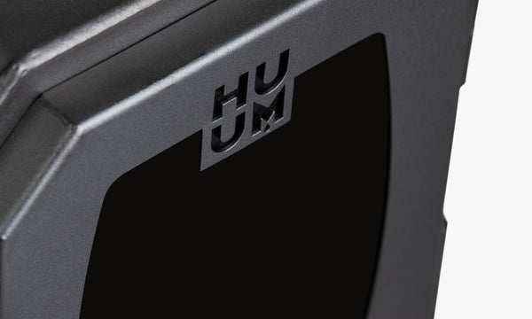 HUUM HIVE Wood Wood-Burning Sauna Heater with grey stones on a white background