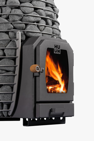 HUUM HIVE Wood Wood-Burning Sauna Heater with grey stones on a white background