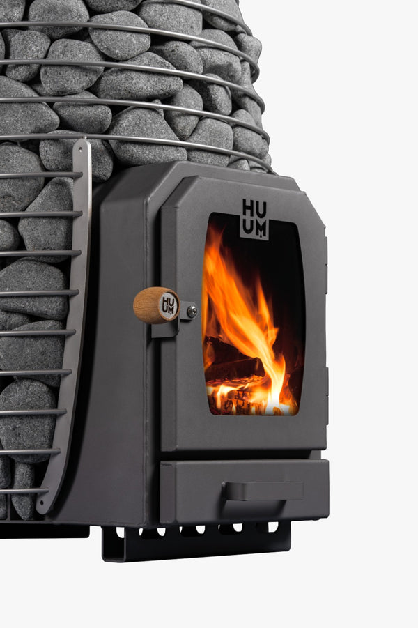 HUUM HIVE Wood Wood-Burning Sauna Heater with grey stones on a white background