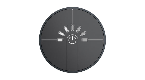 Round black control panel with power symbol on a white background