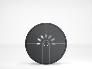 Round black control panel with power symbol on a white background