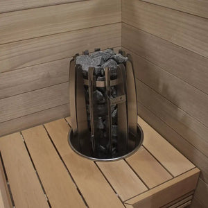 Sauna stone holder with stones inside a wooden sauna room