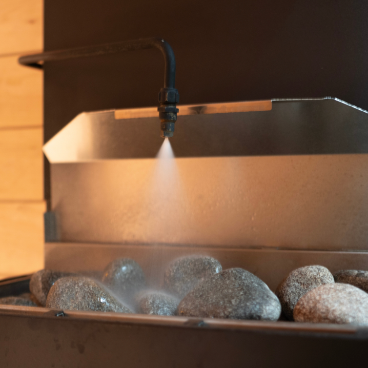 Sauna water dousing system