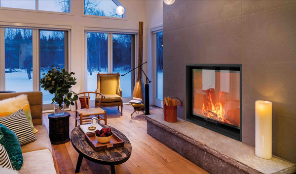 Modern living room with a fireplace, couch, and decorative items.