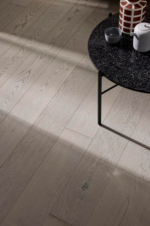 Wooden floor with a black coffee table