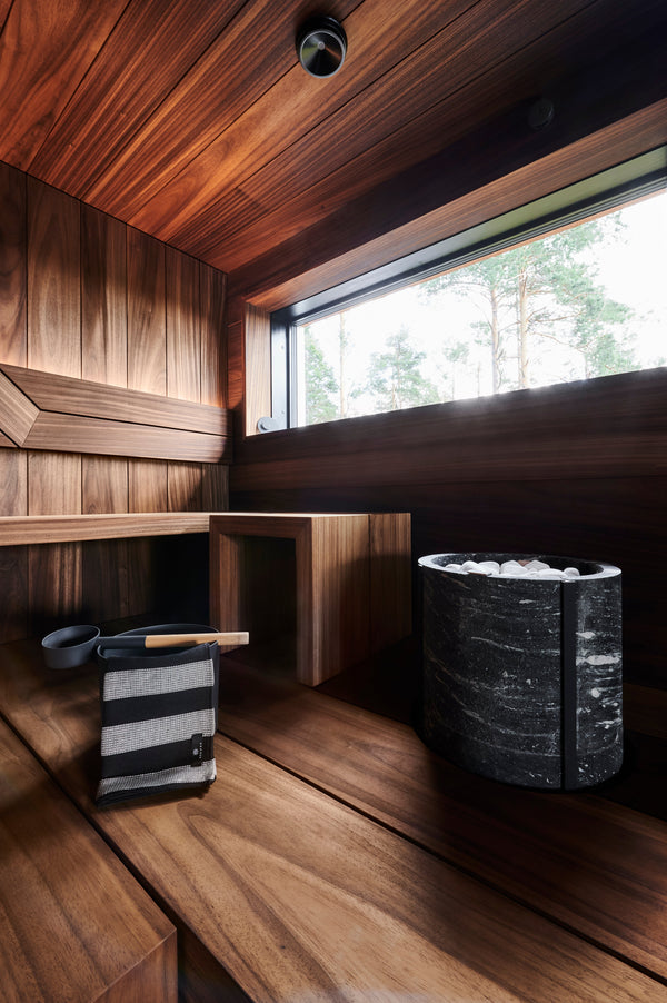 Round Standing Soapstone Cladded Electric Sauna Heater Tulikivi Naava Nobile Integrated In Traditional Finnish Sauna
