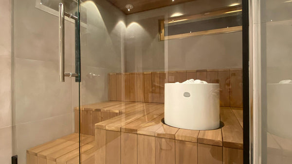 Round Standing Top Cast Stone Cladded Electric Sauna Heater Tulikivi Kuura 1 Integrated In Typical Finnish Sauna Boards