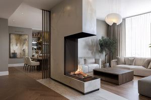Modern living room with a fireplace, sofa, and decor elements.