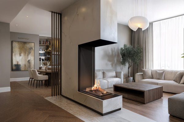 Modern living room with a fireplace, sofa, and decor elements.