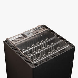 Electric sauna heater with metallic components on a white background