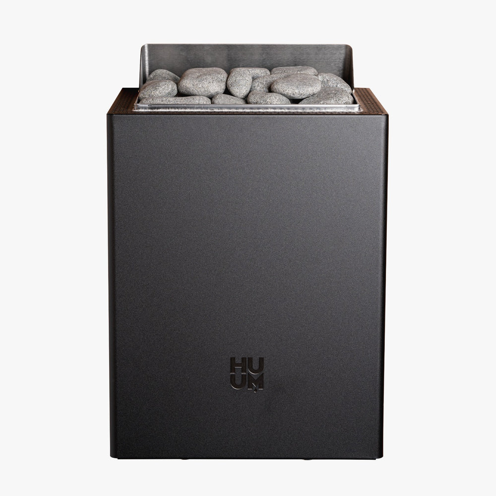 HUUM black electric sauna heater with grey stones on a white background