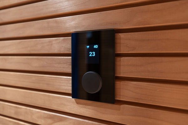 Digital temperature display on a wooden wall