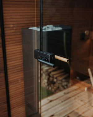 Glass door with black handle and wooden interior