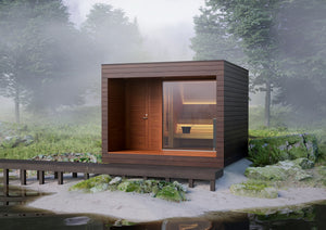 Wooden sauna cabin in a foggy forest setting