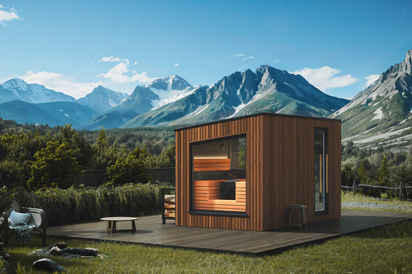Wooden cabin with a mountainous landscape in the background