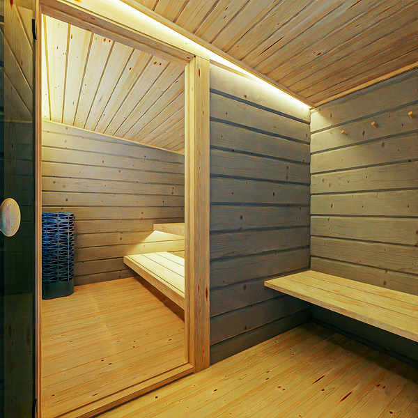 Wooden sauna interior with benches and a stack of wooden planks.