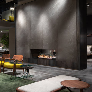 Modern living room with a fireplace and stylish furniture.