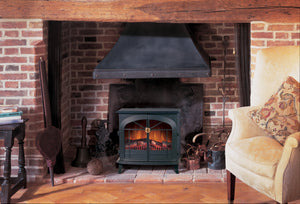a brick living room that has fireplace as a centre piece 