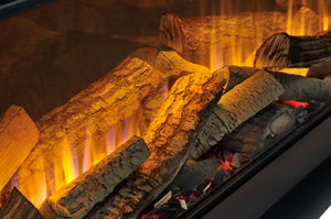 Close-up of burning logs in a fireplace with glowing embers.