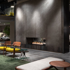 Modern living room with a fireplace and stylish furniture.