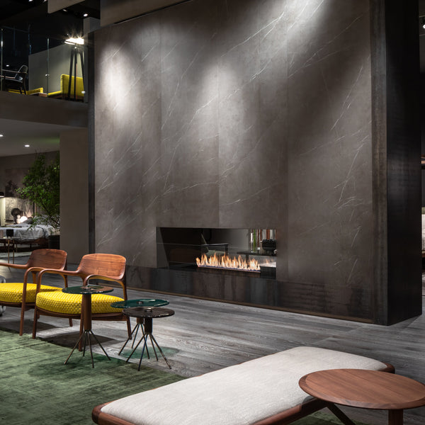 Modern living room with a fireplace and stylish furniture.