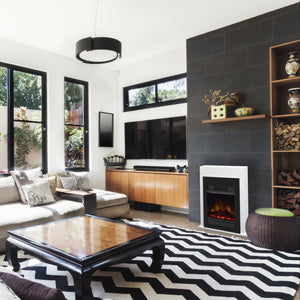 Modern living room with a sectional sofa, coffee table, and fireplace.