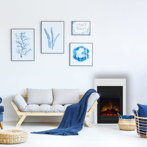 Modern living room with blue armchair, white sofa, and decorative elements.
