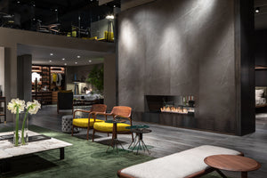 Modern living room with a fireplace and stylish furniture.