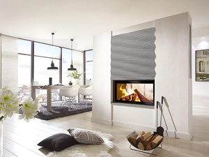 Modern living room with a fireplace and large windows.