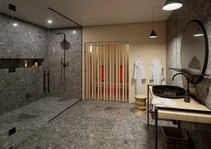 Modern bathroom with dark stone walls, wooden vanity, and hanging bathrobes.
