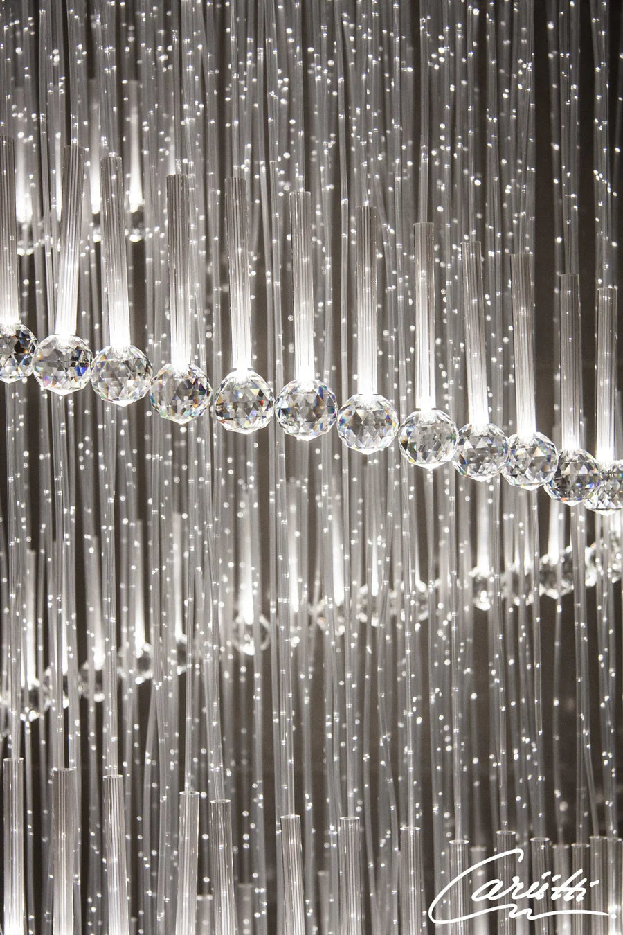 Close-up of a chandelier with crystal balls and thin rods