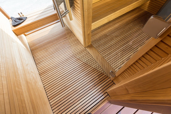 Wooden deck with a step leading to a door
