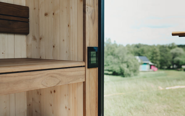 Wooden sauna with a view of greenery outside